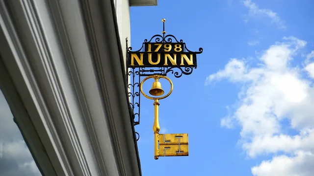 sign, key, business, symbol, retail, service, england, uk, hertfordshire, britain, gold, metal, blue key, blue metal, blue service. What updated commerce reviews UK regulations mean for English retailers